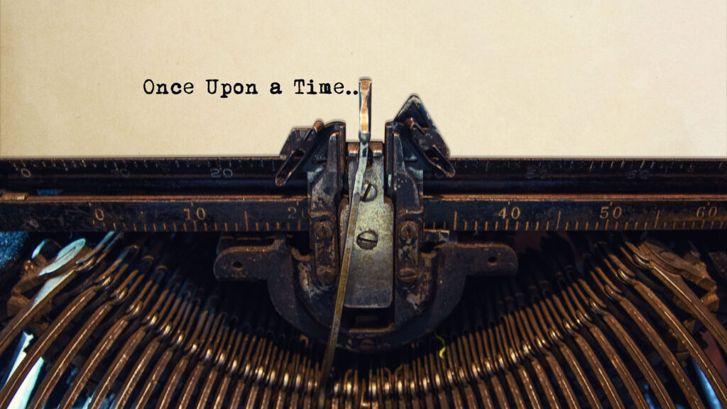 An antique typewriter typing 'Once Upon a Time...'