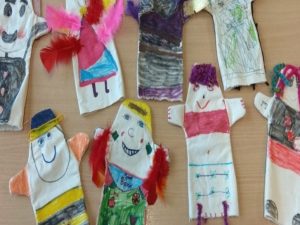 Colourful paper made children with added feathers