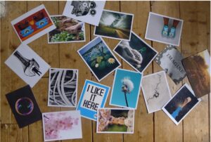 Postcards scattered over a wooden floor