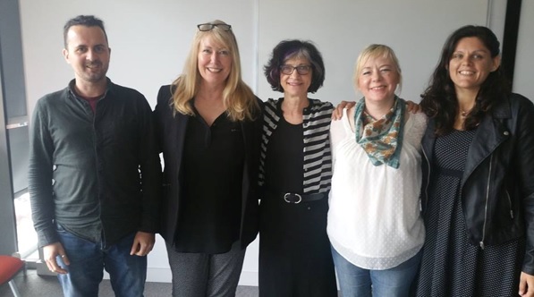 Richard, Claire, Jody, Andrea and Karynn standing together, smiling at to the camera.