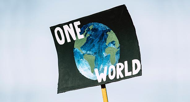 Photo by Markus Spiske on Unsplash, poster; drawing of earth with 'one world' text.