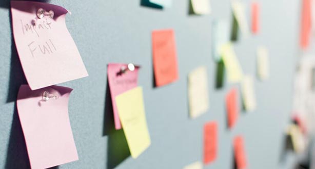 Post it notes on a board, pic by patrick-perkins on unsplash