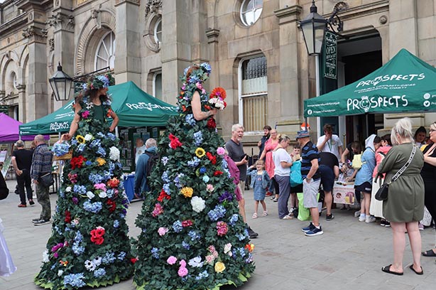 Eco-Fest 2023, performers dressed as christmas trees walking the streets, PROSPECTS Foundation - pic by PF