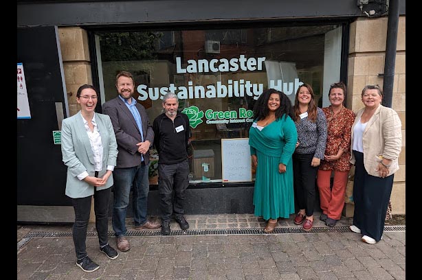 Lancaster Sustainability Hub Team standing infront of the office window.