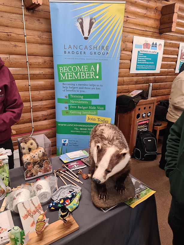 Lancashire Badger Group promotional table with banner and other related items on a table