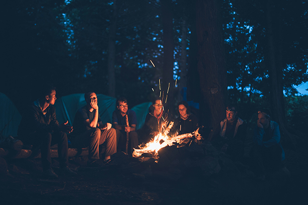 Photo by Mike Erskine on Unsplash, kids sitting around a campfire