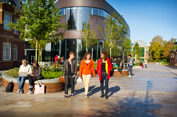 Students walking outside the HUB on a sunny day