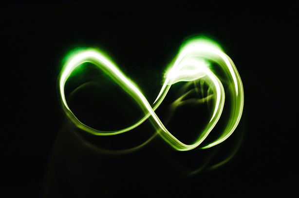 Photo by Aedrian Salazar on Unsplash, neon green infinity swirling light