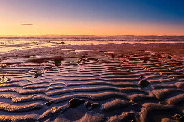 Photo by Jonny Gios on Unsplash, Morecambe Bay beach and sea with the Lake District in the background