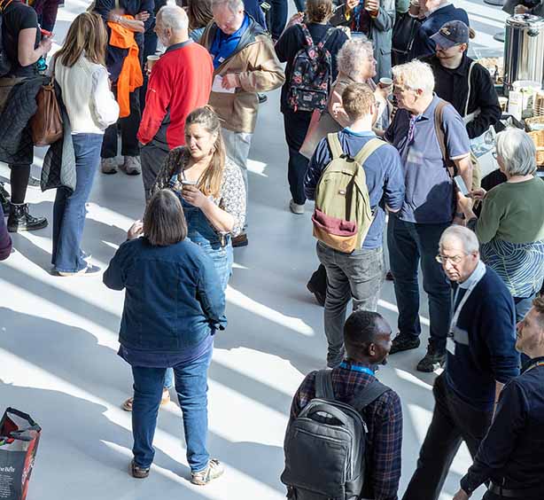 Forum attendees networking in the main reception