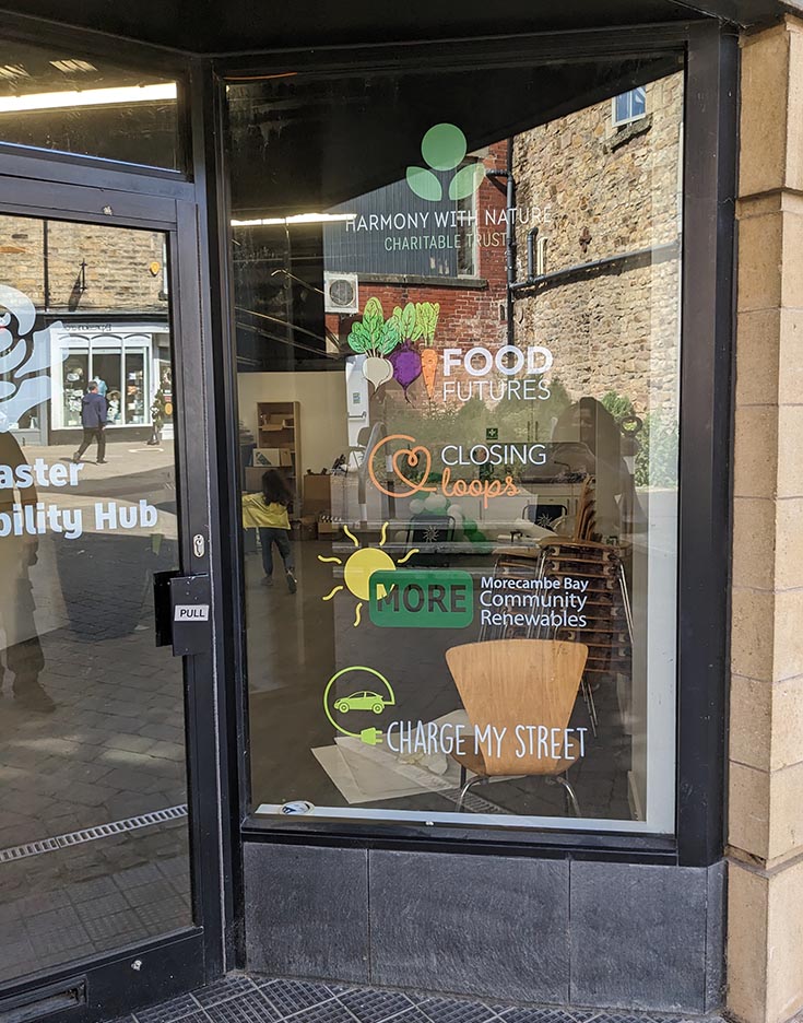 Lancaster Sustainability Hub Team partner logos on office space door.