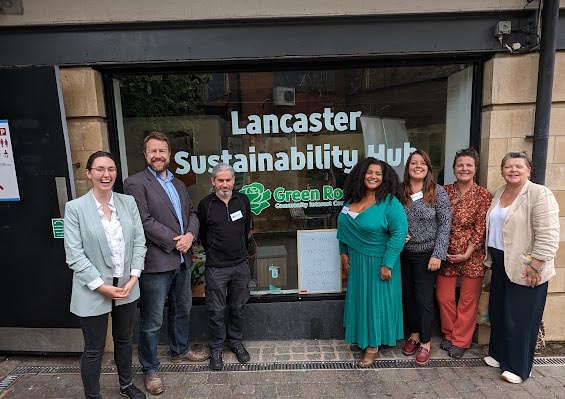 Lancaster Sustainability Hub Team standing infront of the office window.