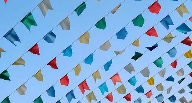 10 strips of multi-coloured flags, Photo by Marco Bianchetti on Unsplash 