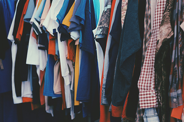 Photo by Nick de Partee on Unsplash, clothes on a rail