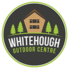 Whitehough Outdoor Centre logo, circle with a dark green background, containing an illustration of a log cabin, trees and white and green text