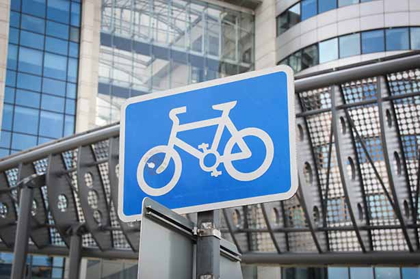 Photo by Gary Butterfield on Unsplash, blue and white bike cycling sign Leeds