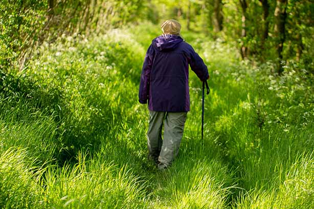 Photo by david Griffiths on Unsplash, person walking along a footpath