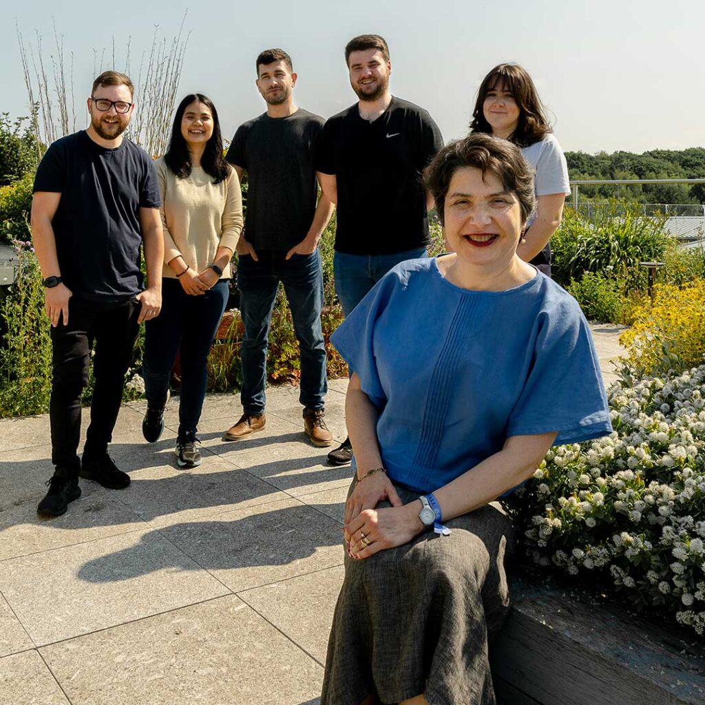 Luminita and with Dr Daniel Grimes, Gunticha Suwanmanee, Dr Ioan Matei, Oliver Maldon and Lauren Blood in the rooftop garden on Edge Hill University's campus