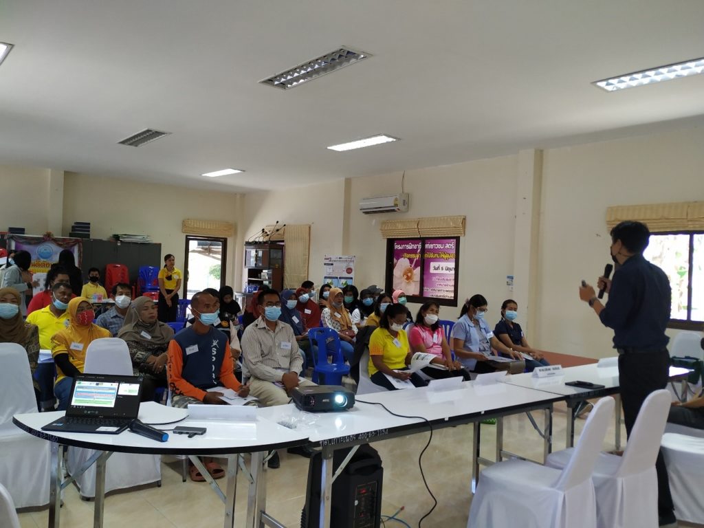 An image of participants listening to a presentation. 
