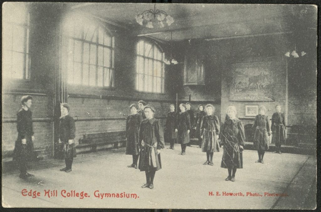 Edge Hill College girls standing in the gymnasium