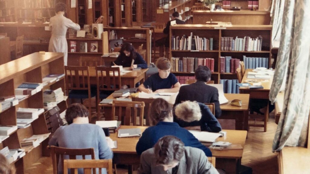 Historical image of students working in a library
