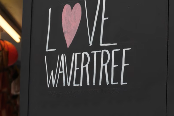 Love Wavertree text written in white on a chalkboard with a red heart for the 'o'.