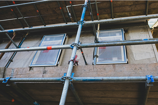 Photo by Jessy Smith on Unsplash, house building project, scaffolding and window fitting