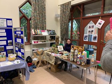 Staff member of Eco Bricks sitting at their stall