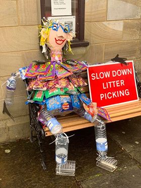 Lucy, recycled scarecrow sitting on a bench