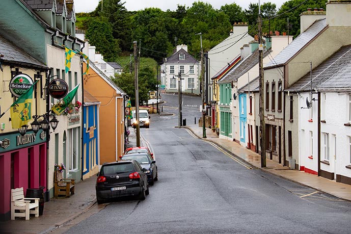 Cars parked on a street in a town in Ireland