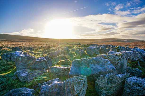 Sun setting on yorkshire limestone pavement