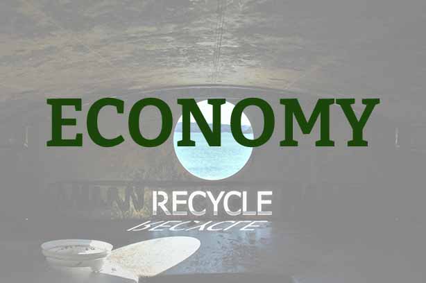 Photo by QuackyMcduck on Unsplash, the word 'recycle' cut on in metal within a container