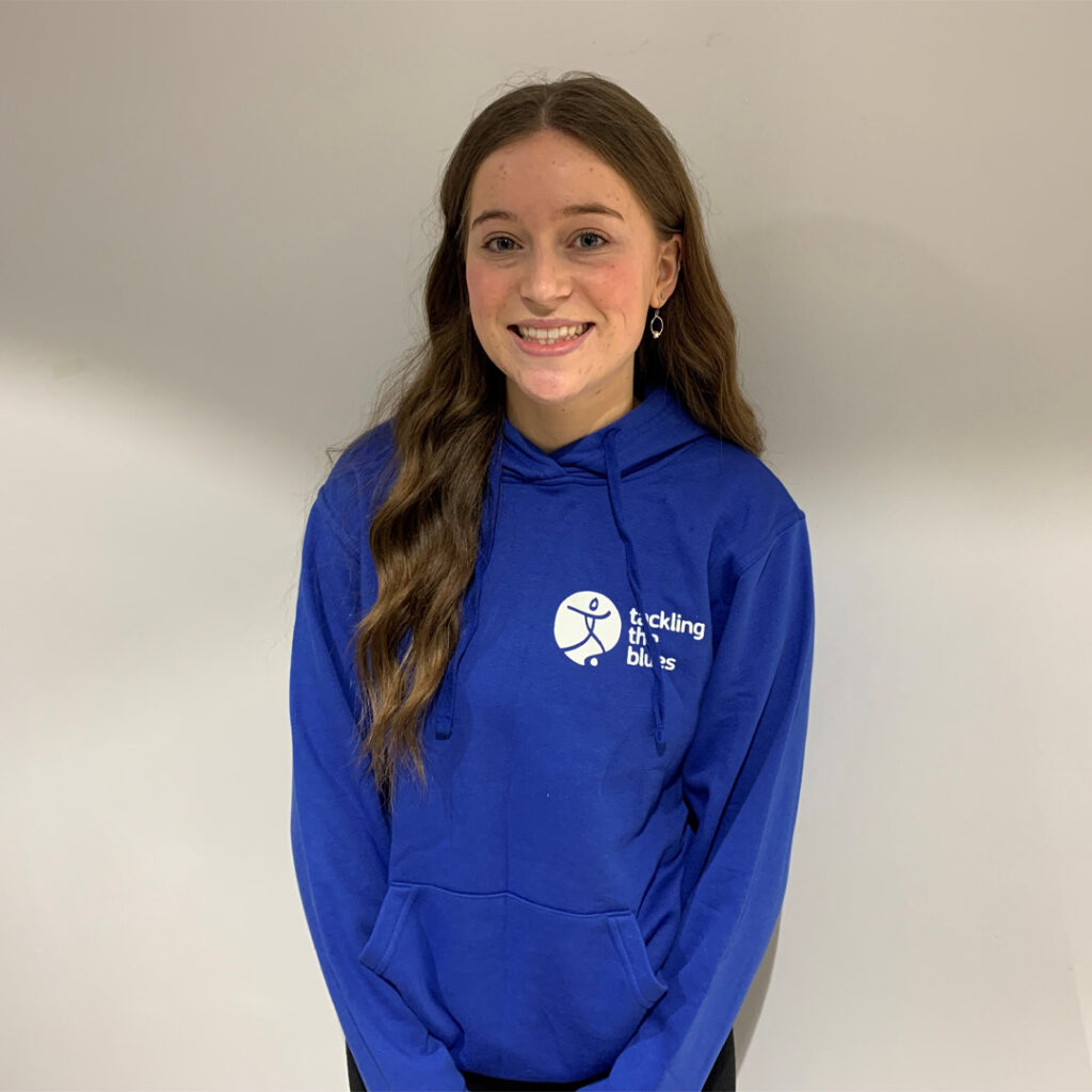 Lucy Brooks in a blue Tackling the Blues hoody 
