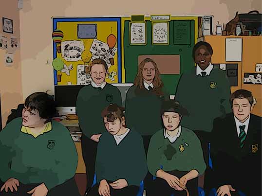Voices - students posing for a photo in their classroom