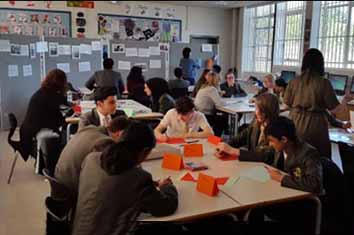 Voices - students working at desks in their classroom