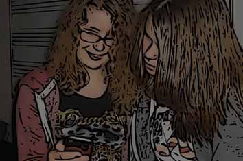Voices - two girls looking at a mobile